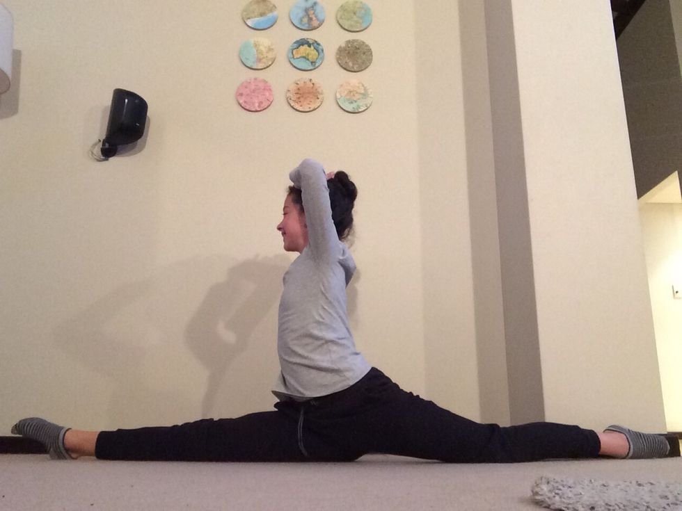 Having a flat split is essential, once you have achieved it, try to put your hands on your head and balance!