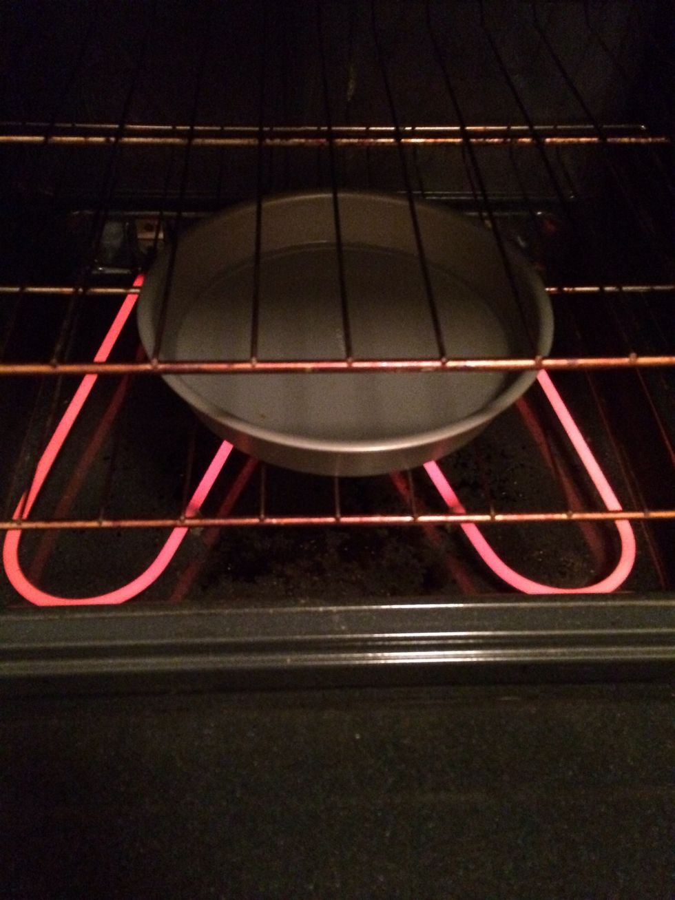 Having a pan with some water helps to not dry out the bread while cooking.