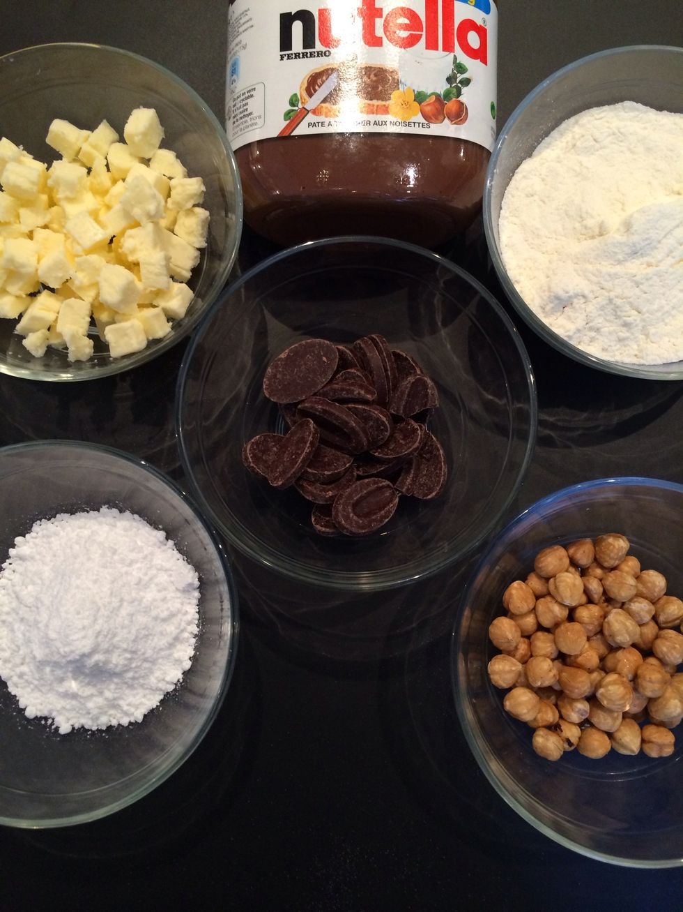 Hazel nuts, icing sugar, rice flour and butter. For the garnish dark chocolate(I used 85%) especially if you add Nutella otherwise it is very sweet
