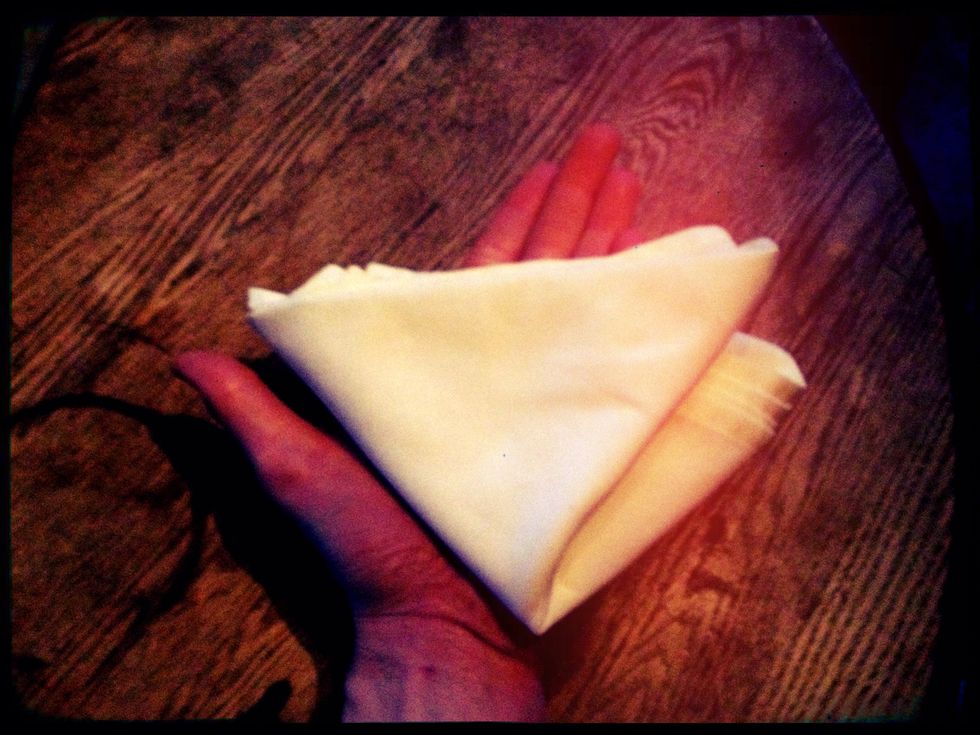 He shook the handkerchief open and carefully placed it over the palm of his hand. He uttered the following incantation: \u201cAbracadabra, puddin\u2019 pie, kiss the girls and make them cry.\u201d