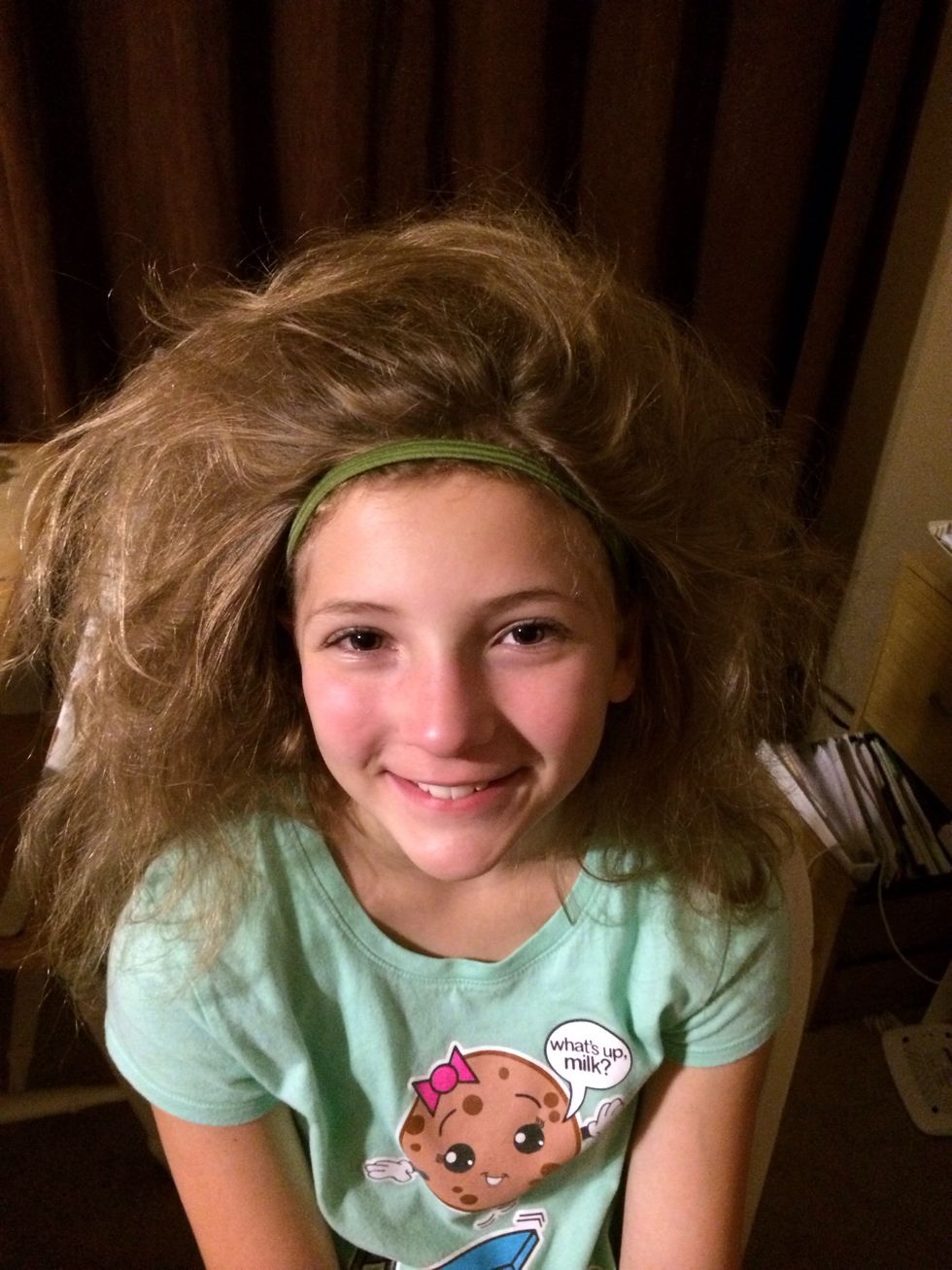 Headband on first to keep it out of her face then tease the hair by back combing.