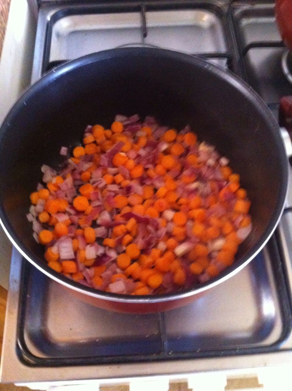 Hear the oil then add onions, garlic and carrots. Cook until softened