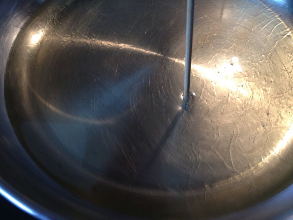 Heat 1 cup (or more) oil in a pan. Oil amount depends on how big your pan is. The bigger the pan the more oil you'll need. It's important for the peanuts to be submerged in the oil for even cooking.