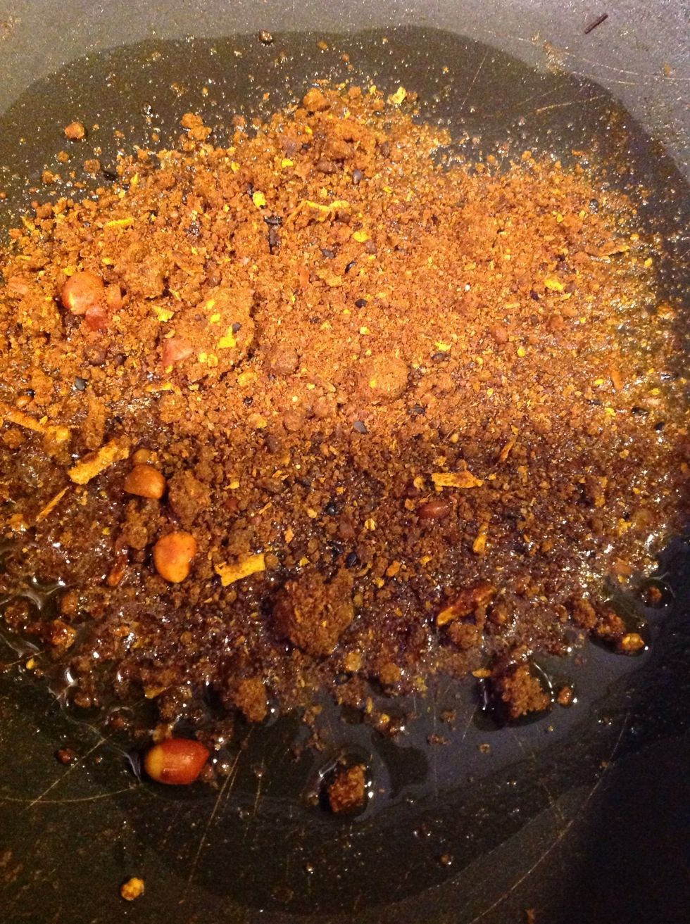 Heat 1 tbsp oil in a pan and add the powder.