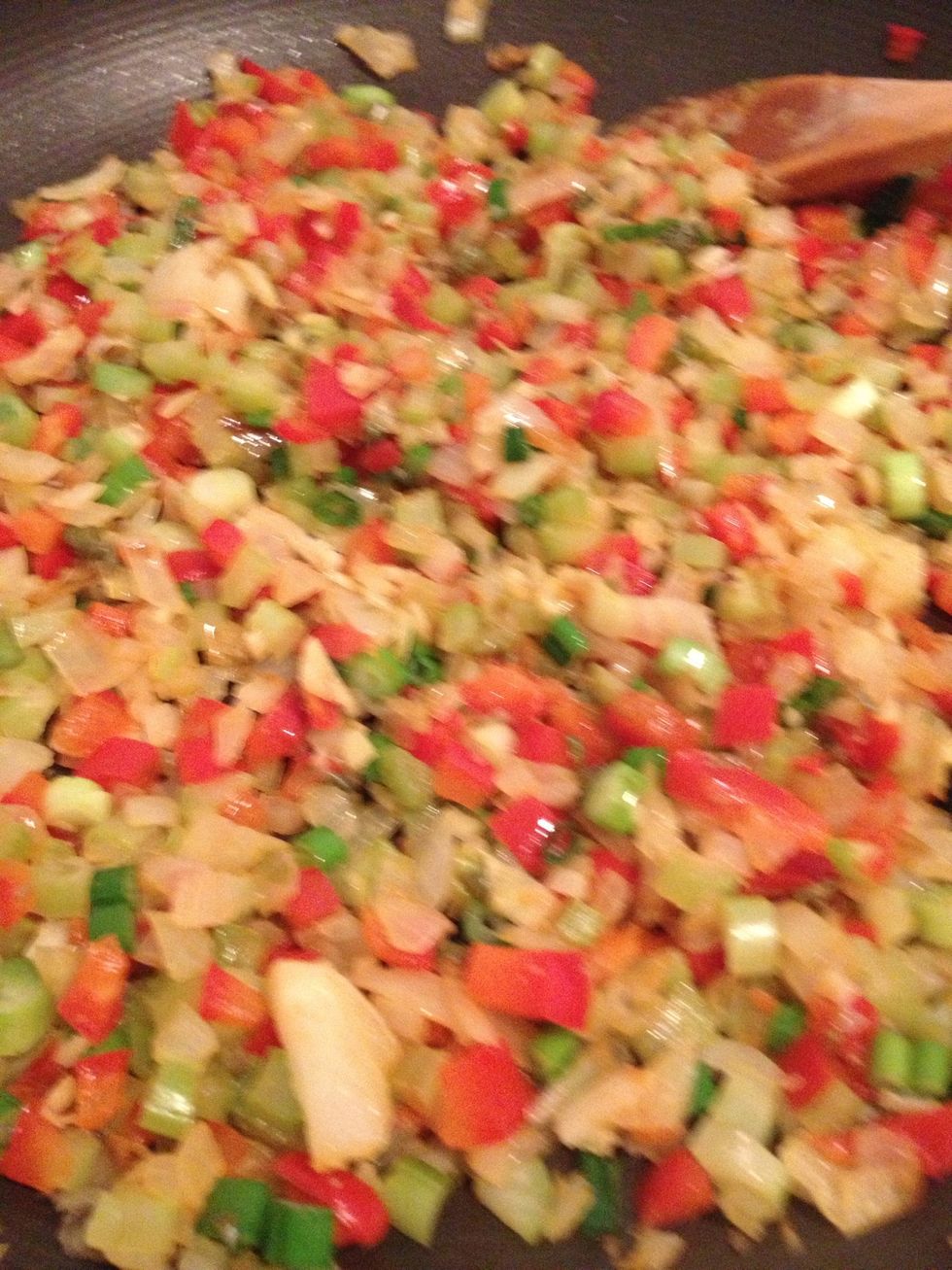 Heat 1T olive oil in pan and add all vegetables starting with onion, garlic, and ginger.  Saut\u00e9 over medium heat. Cook until vegetables are soft and aromatic.