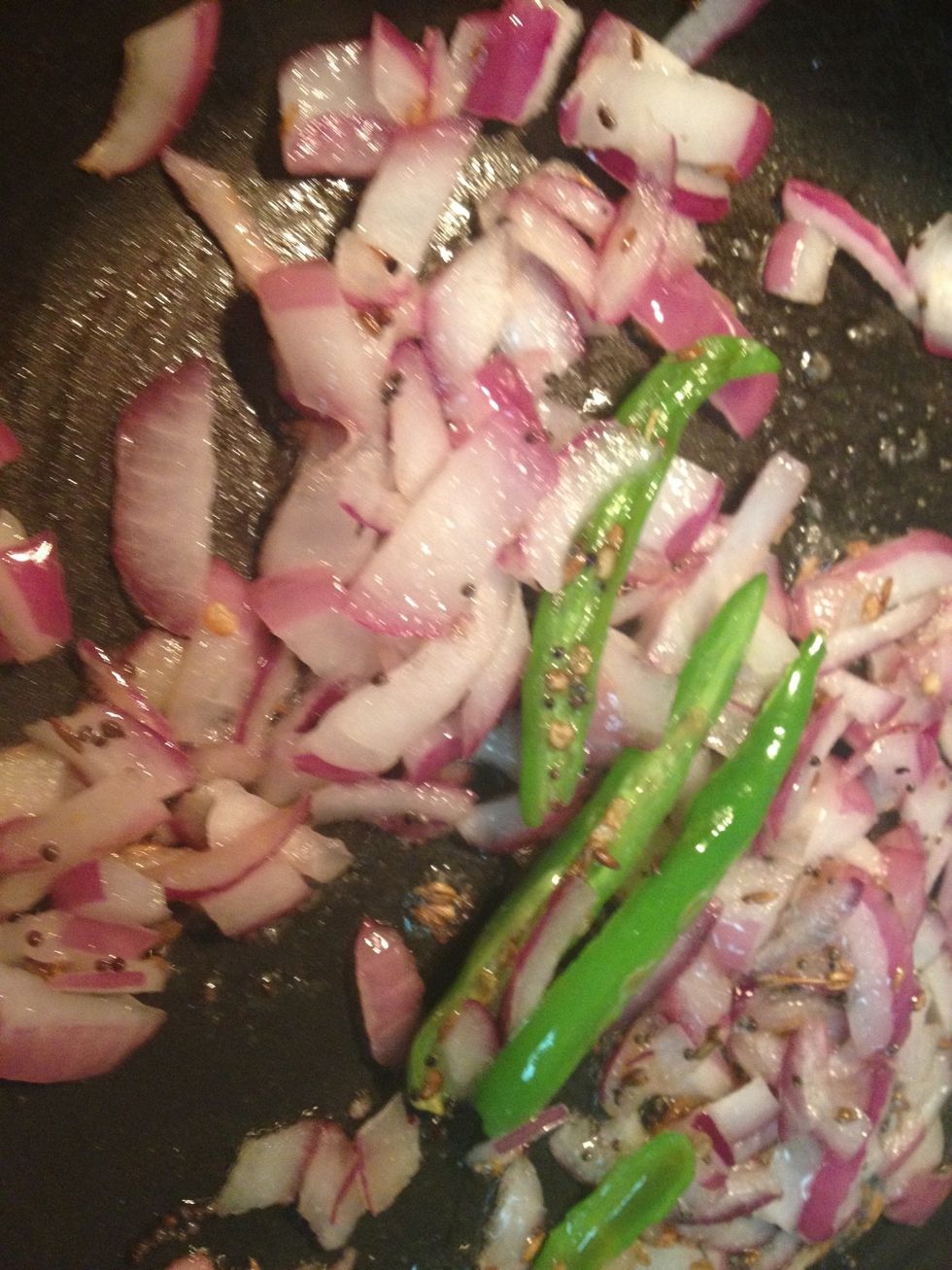 Heat 2 tbsp oil in a pan and add mustard seeds when they start spluttering add cumin seeds and in 5 secs add green chillies and chopped onions