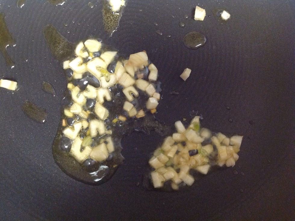 Heat 2 tsp oil in a pan, add a little chopped garlic for flavor