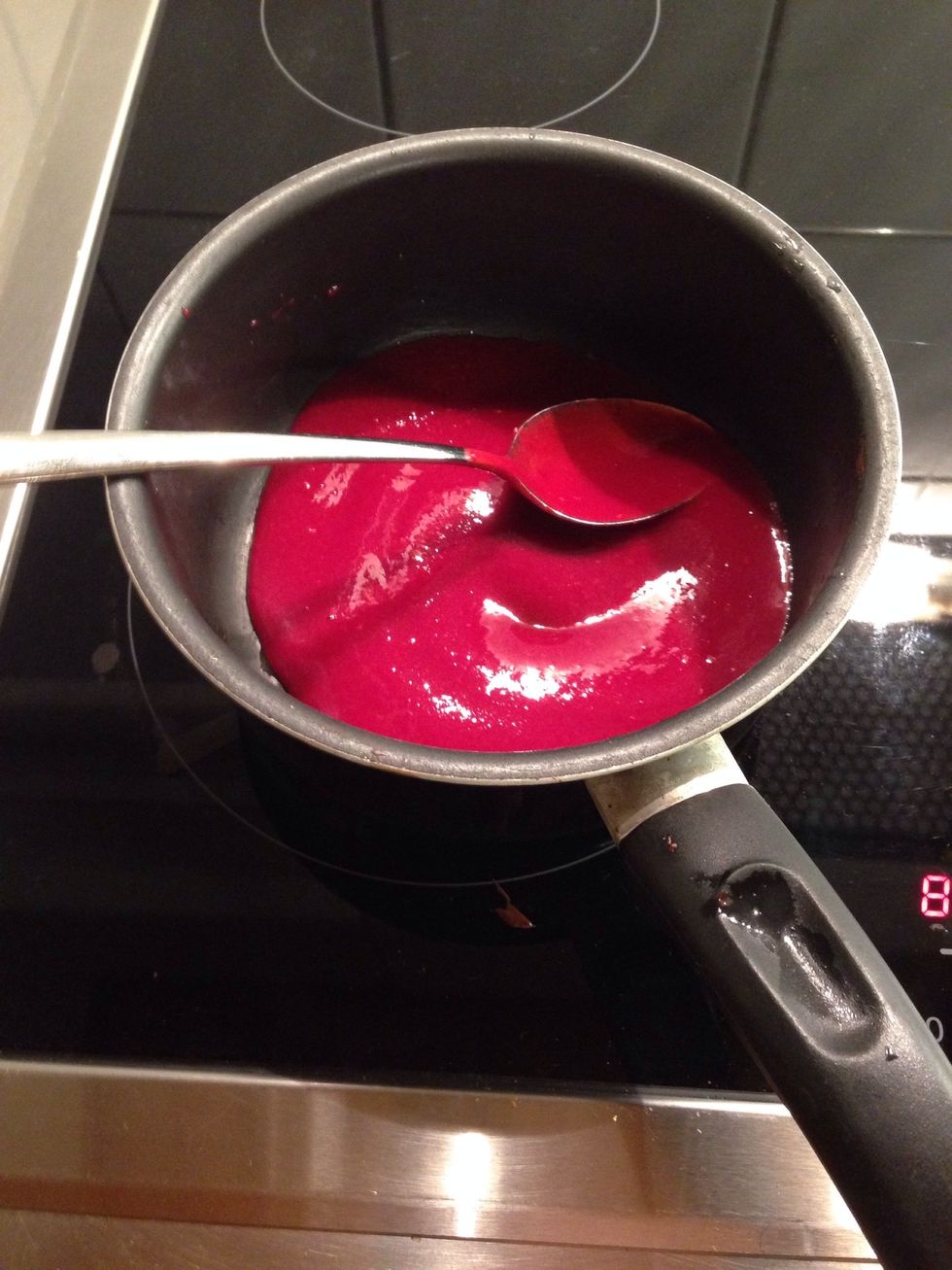 Heat 3/4 of the pur\u00e9ed raspberries