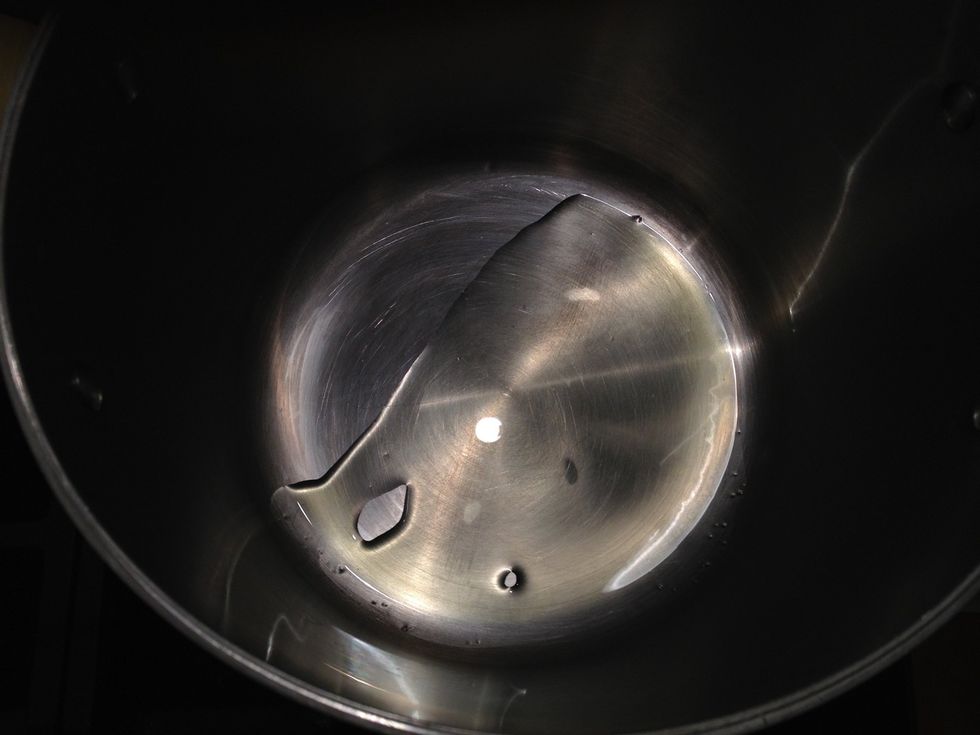 Heat a bit of olive oil in a heavy soup pot.