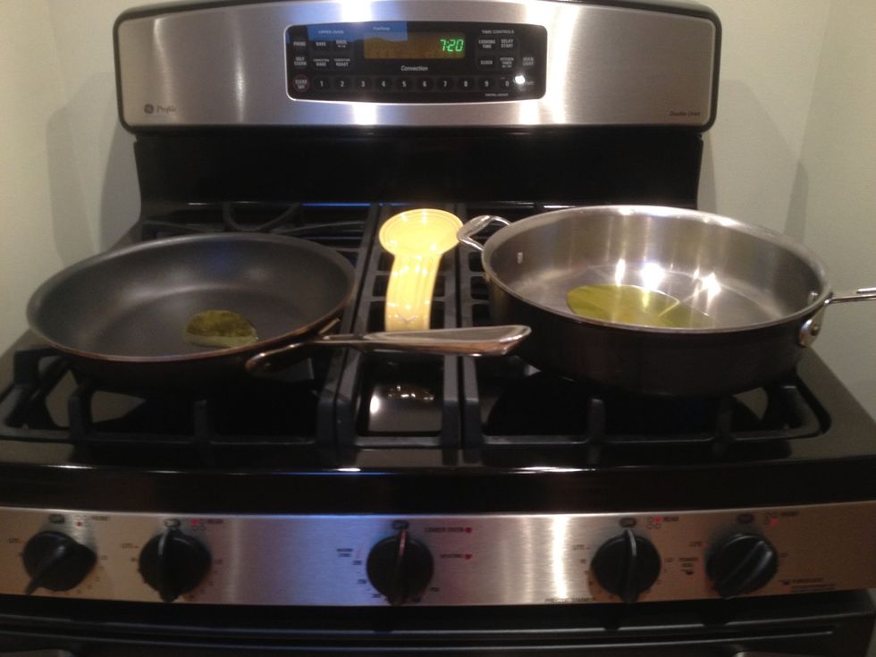 Heat a couple tablespoons of olive oil in 2 skillets. It's important to use 2 skillets so that the cantaloupe and tomatoes sit in one layer. Turn the heat to high.