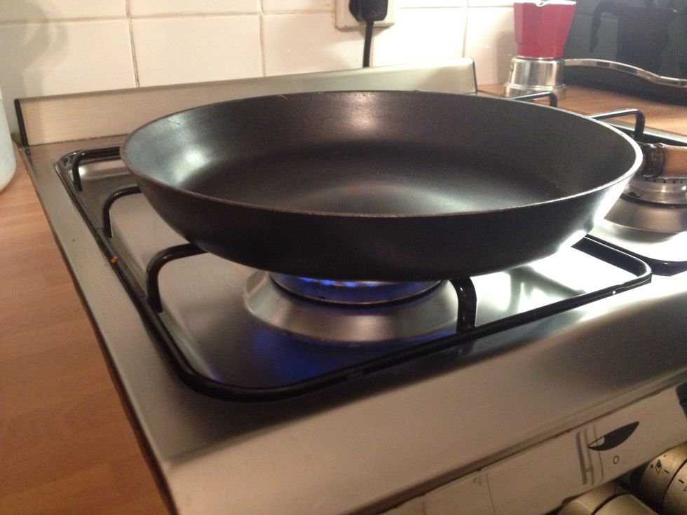 Heat a DRY HEAVY FLAT FRYING PAN OR SKILLET ON VERY HOT GAS / ELECTRIC HOB. NO OIL!!! (5-10 mins) don't worry, it needs heat!! Lots of it