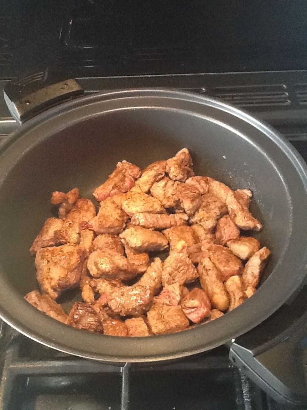 Heat a frying pan and brown the beef a little bit at a time, then add the beef to a stewing pan.