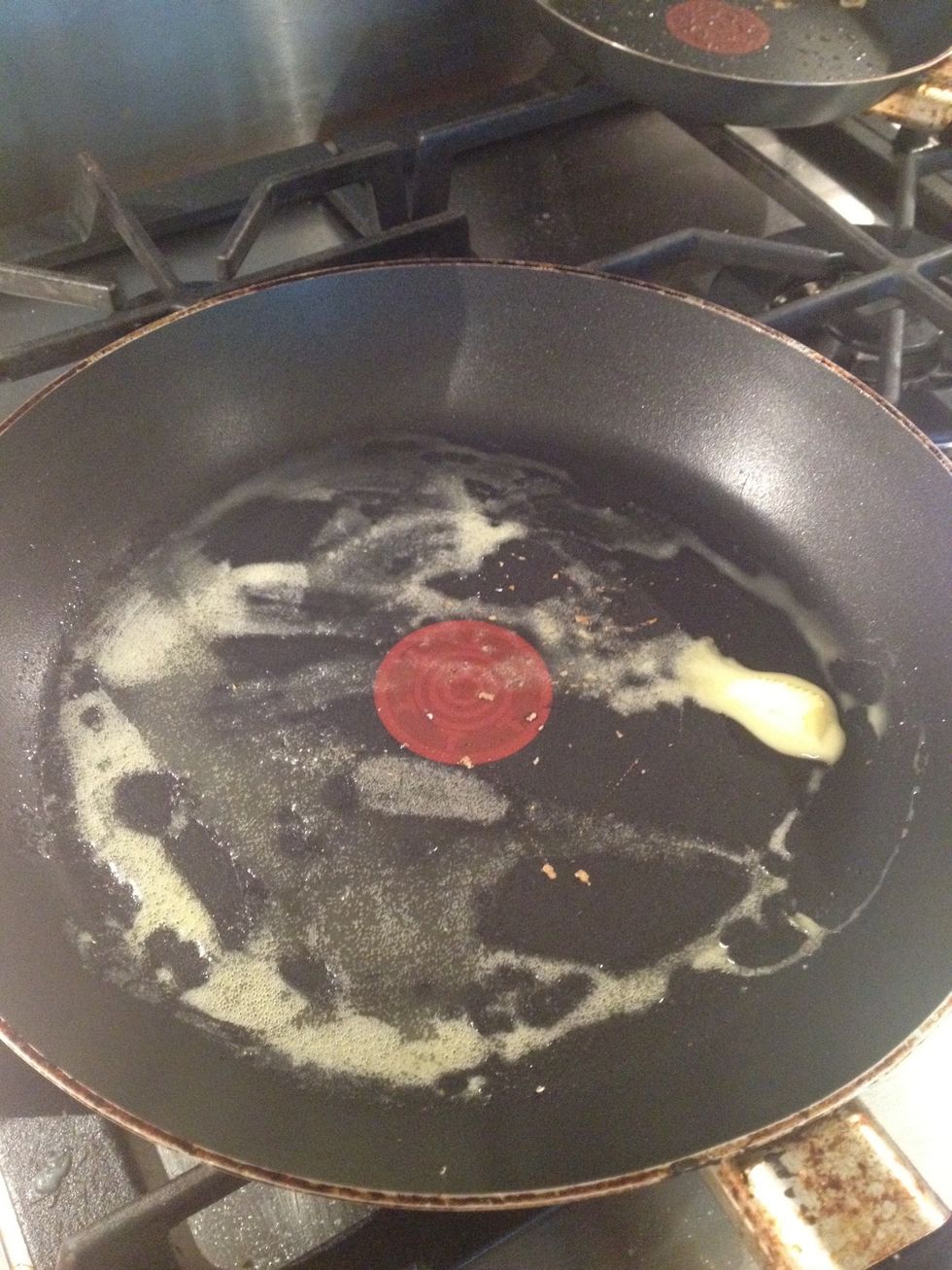 Heat a frying pan, then melt a knob of butter.