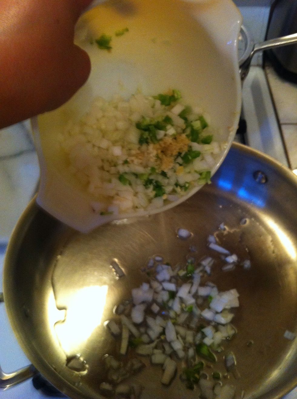 heat a large 12" skillet over medium heat. with remaining 2T. oil, and cook your onion, jalepeno, garlic, and ginger for about 8-10 minutes. stirring frequently (you don't want your garlic to burn)