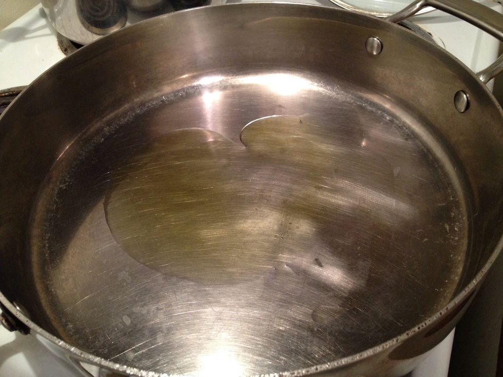 Heat a large skillet on medium low and pour two tbsp extra virgin olive oil into it once it is hot.