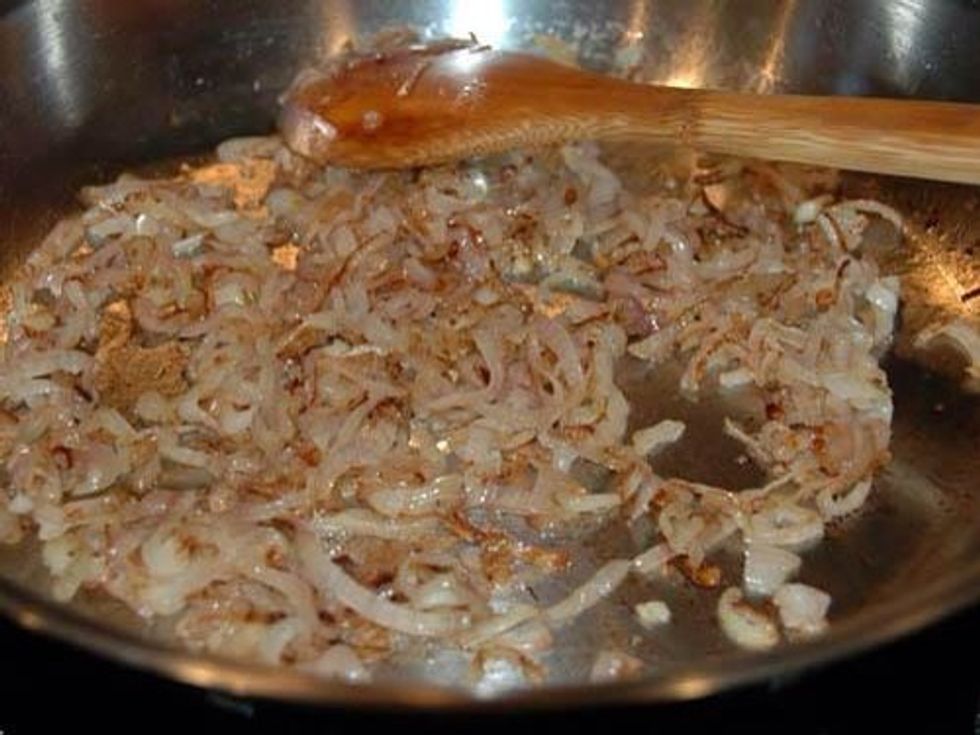 Heat a little oil in a saucepan over low heat. Let the onions cook, stirring only occasionally, until a lovely golden brown.