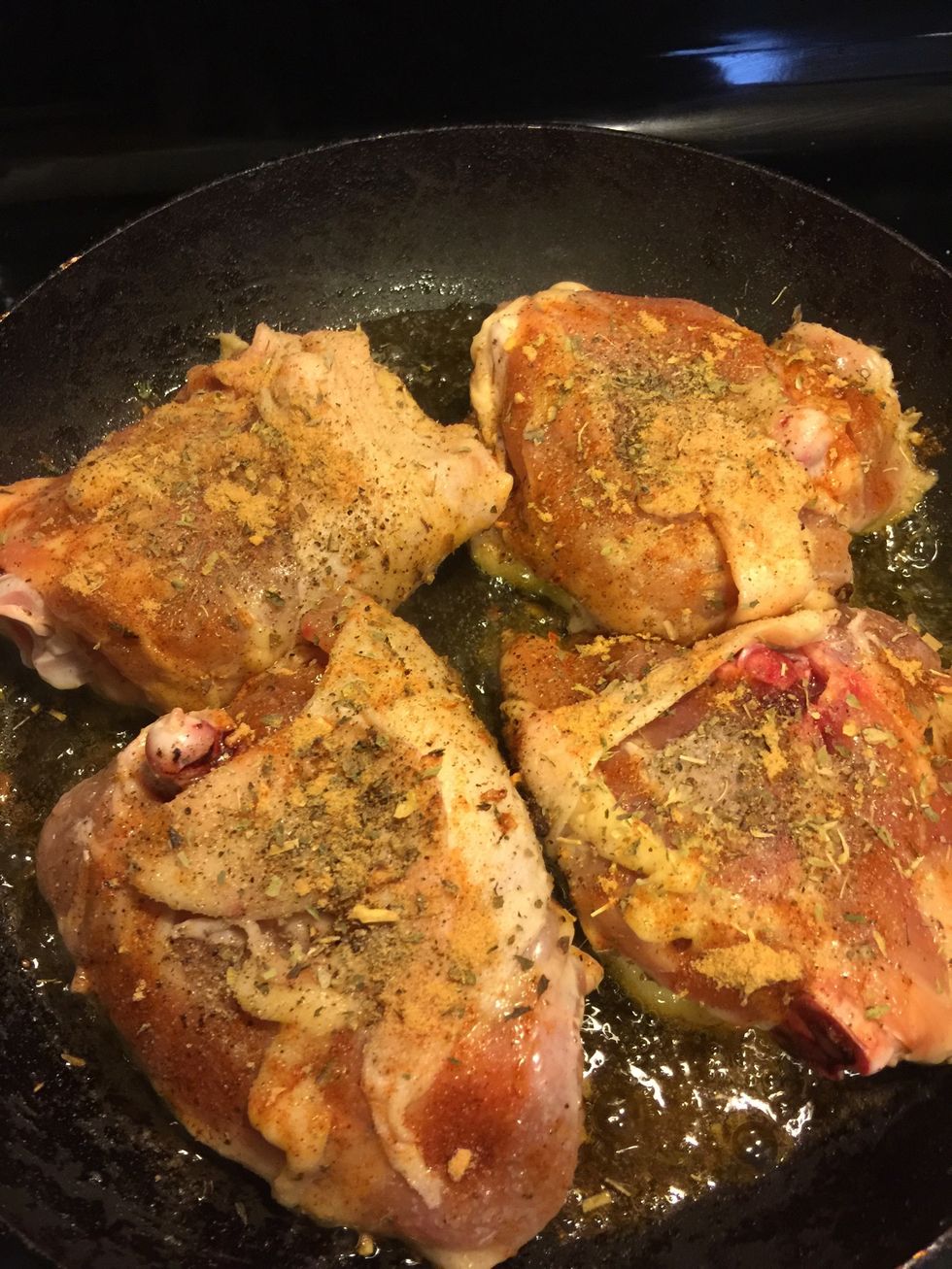 Heat a non stick pan, add two spoons olive oil. Once hot, place the chicken skin side down on the pan. Season the other side. Cook the skin side down for 15 - 20mins on medium flame,till crispy.