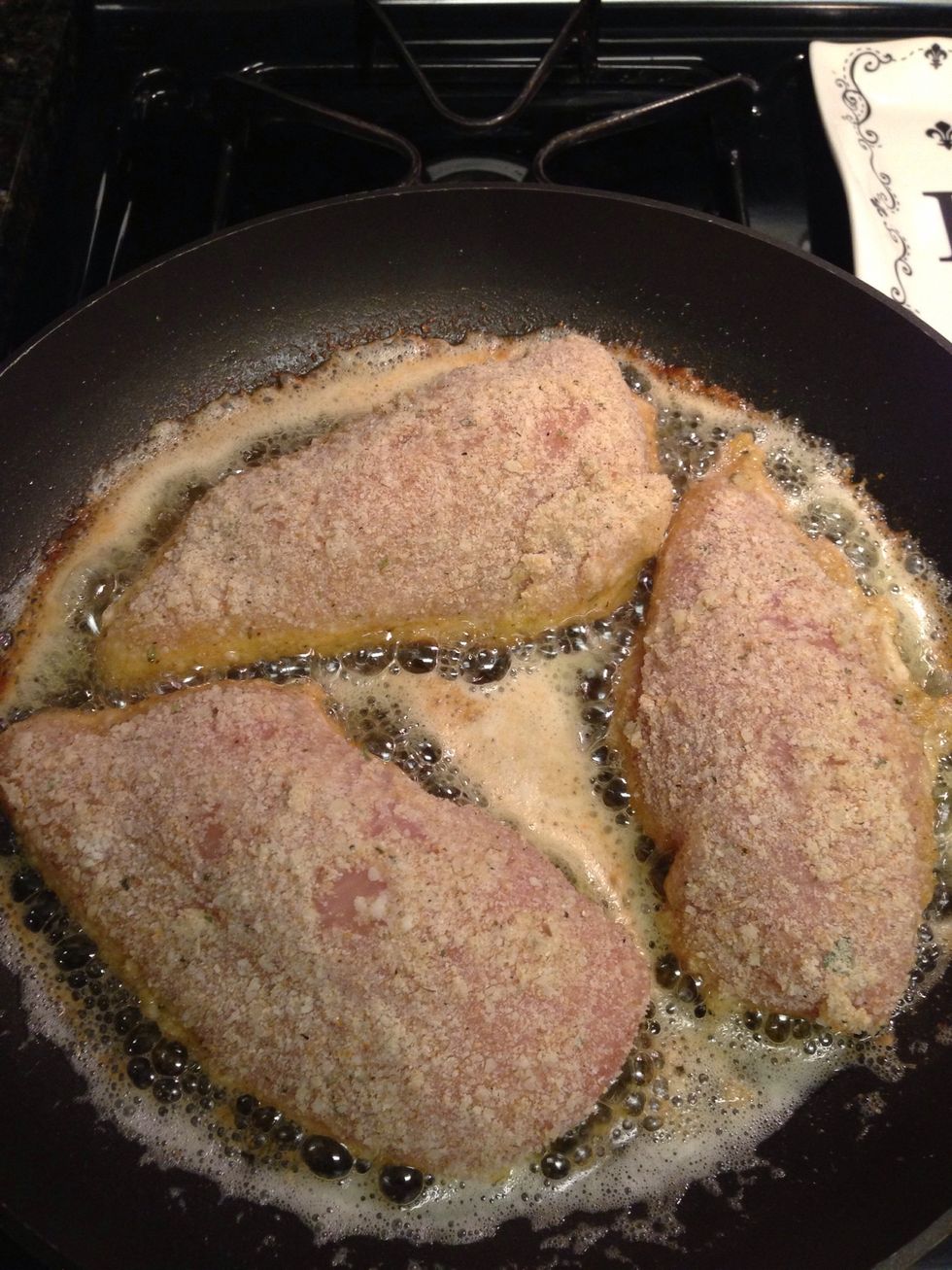 Heat a pan with remaining olive oil and butter on medium-high heat. Brown each side of chicken for 3 minutes.