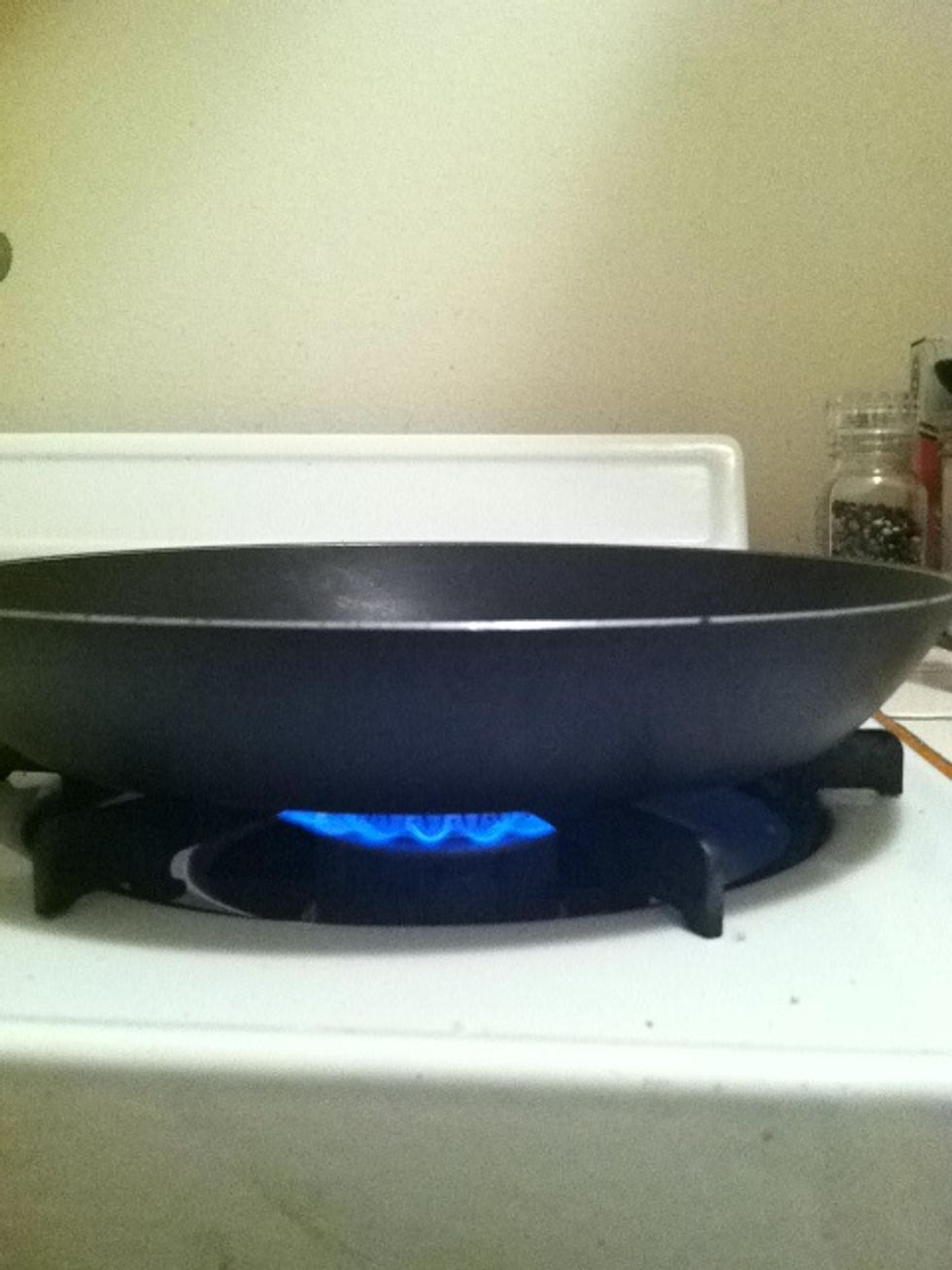 Heat a skillet on medium to high heat with the olive oil in it. If you don't have a gas stove quit now and get a new stove.