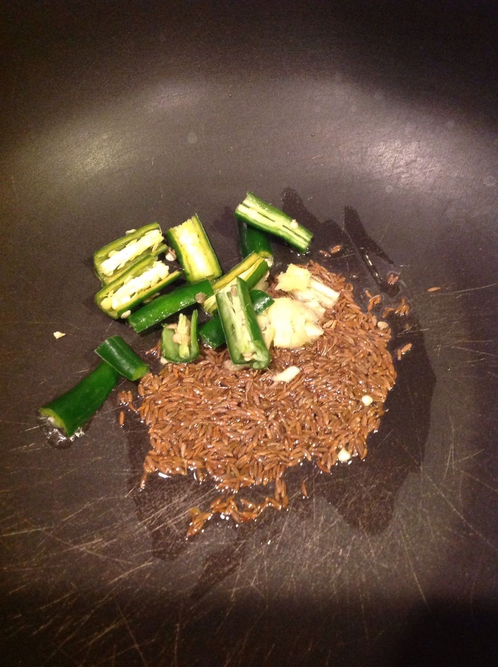 Heat a tsp of oil. After a minute, Add 1 tsp of cumin seeds, green chillies and the cut ginger