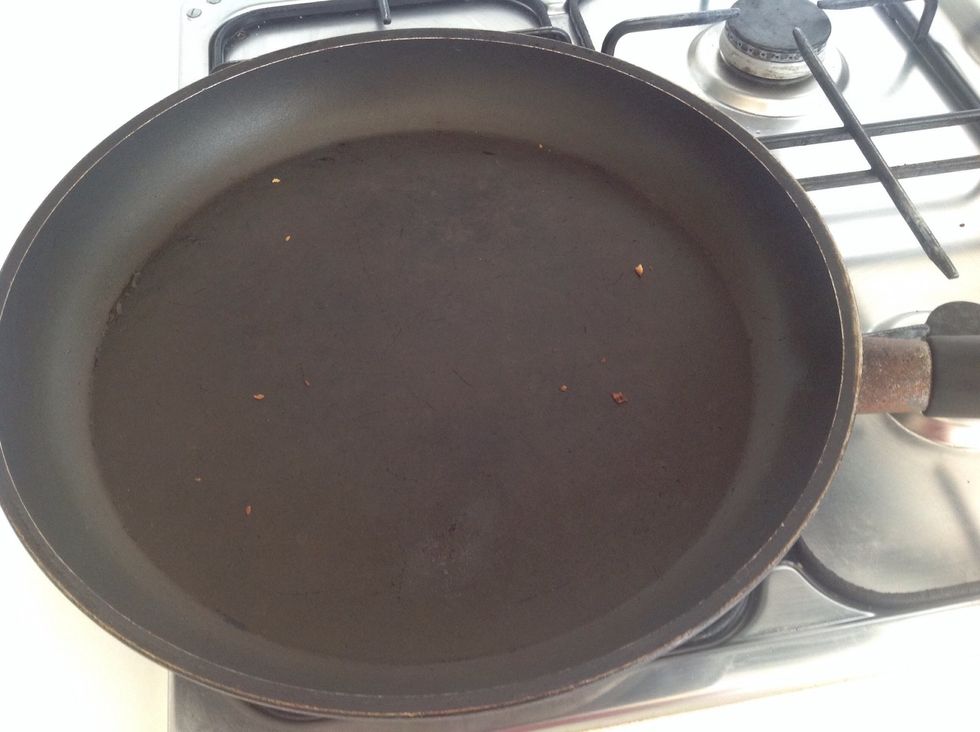 Heat a very large frying pan.