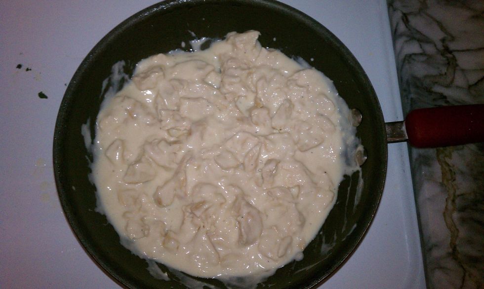 Heat Alfredo sauce and chicken together