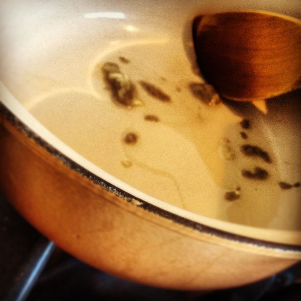 Heat another tablespoon of oil in a heavy good sized saucepan, add the garlic paste and lightly fry until browned.