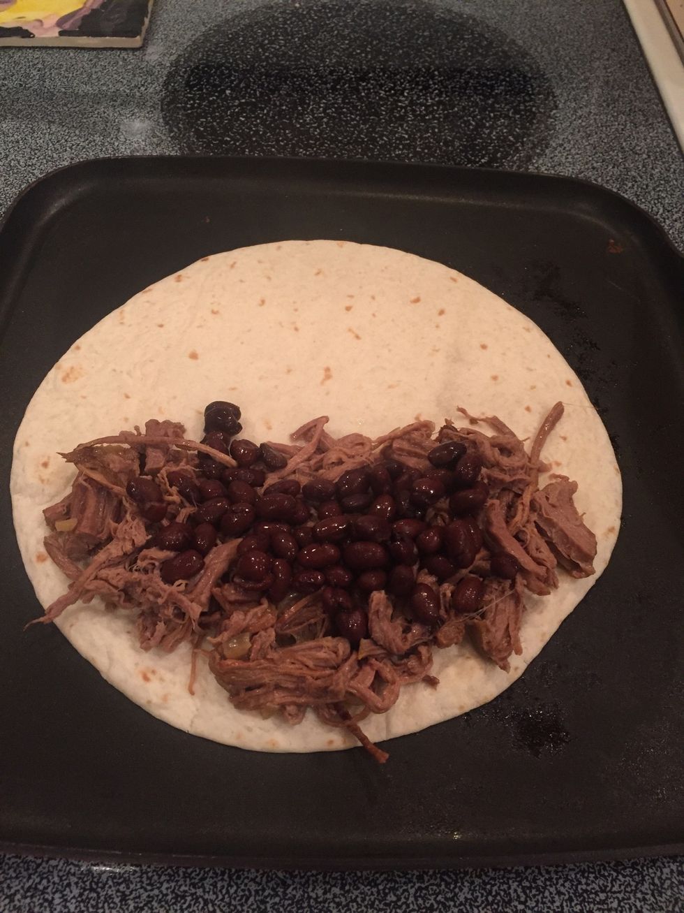 Heat black beans in the microwave or on the stove and add to beef.