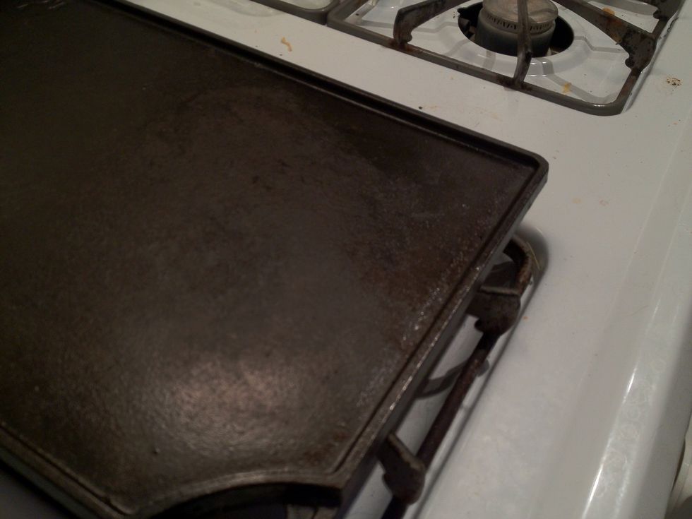 Heat fry pan or skillet to med heat. Fry golf ball sized meatballs on all sides till lighty browned. Once browned, set aside in baking dish.