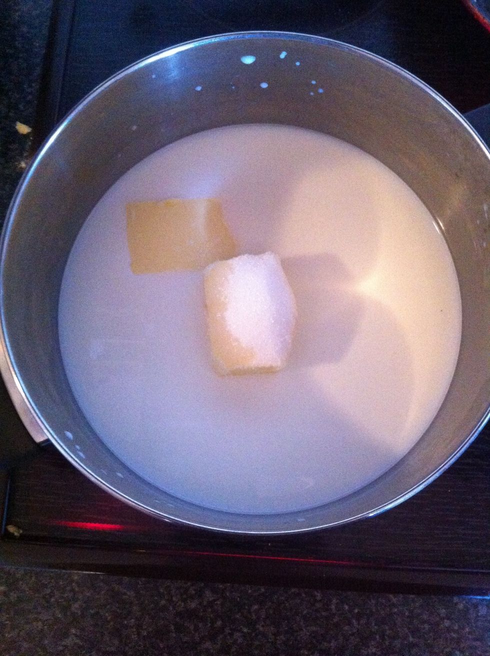 Heat milk until boil ( do not boil just until) than add water, butter and sugar