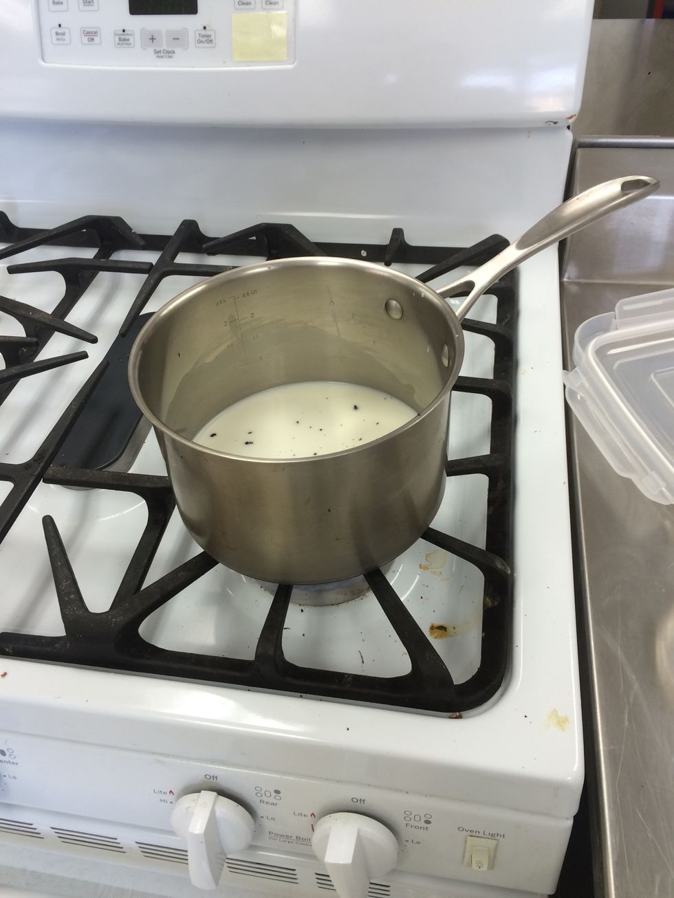 Heat milk with half of the vanilla beans and sugar, until it boils