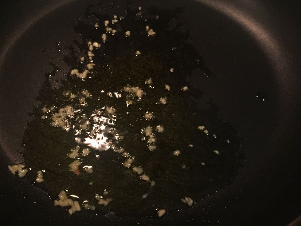 Heat oil and toss in garlic, wait until fragrant.