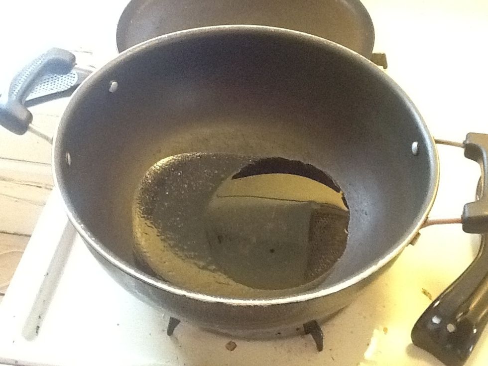 Heat oil in a cooking vessel