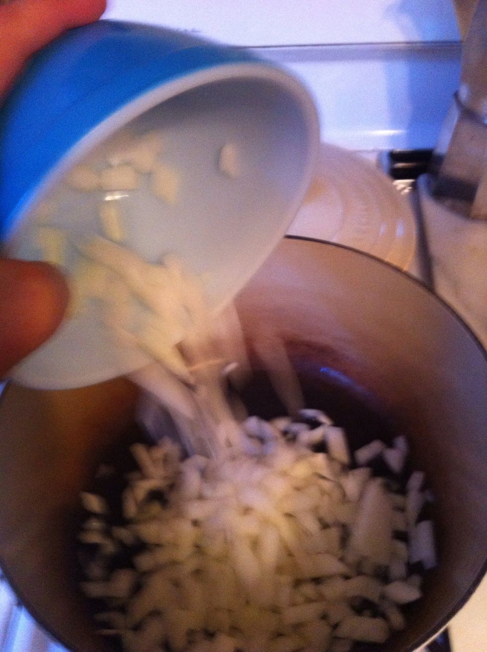 heat oil in a large Dutch oven over medium heat until shimmering and add your onions. saut\u00e9 for 8-10 minutes until light golden. stirring frequently.