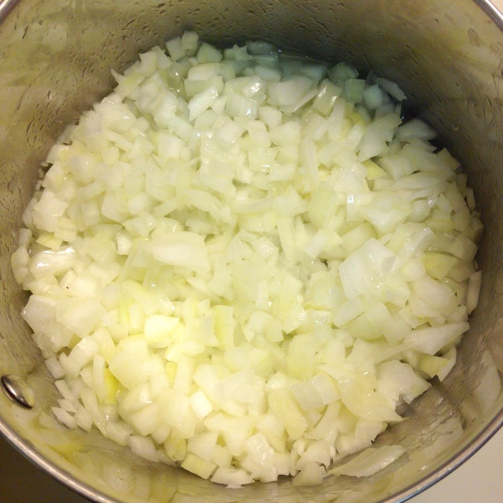 Heat oil in a LARGE stockpot. Saute on medium heat until soft and translucent.