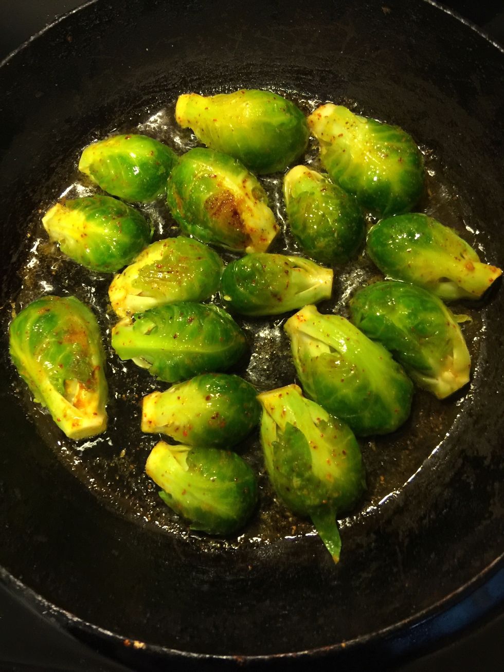 Heat oil in a pan and add the sprouts cut side down.
