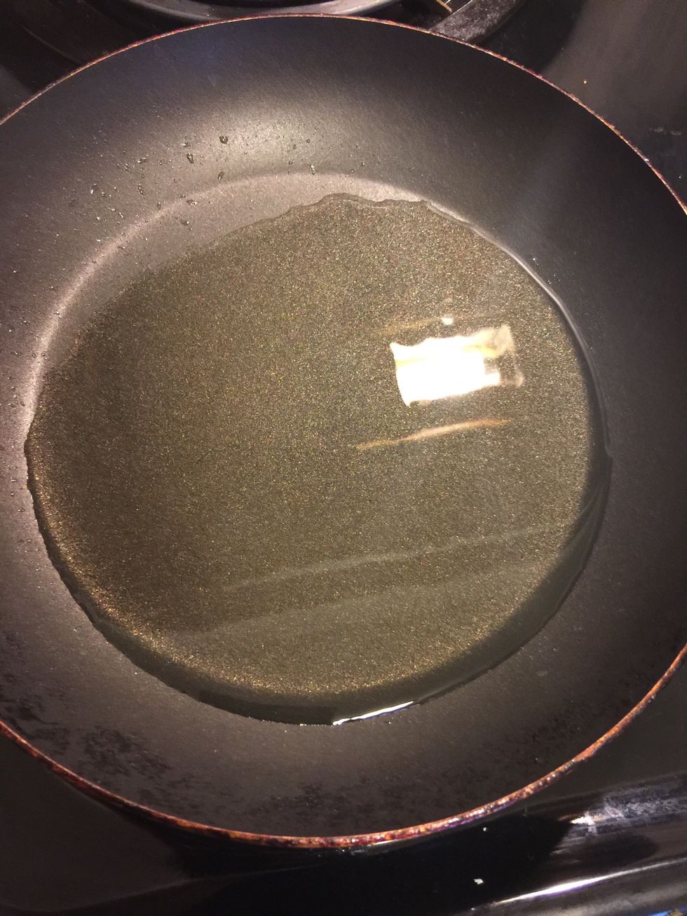 Heat oil in a pan.