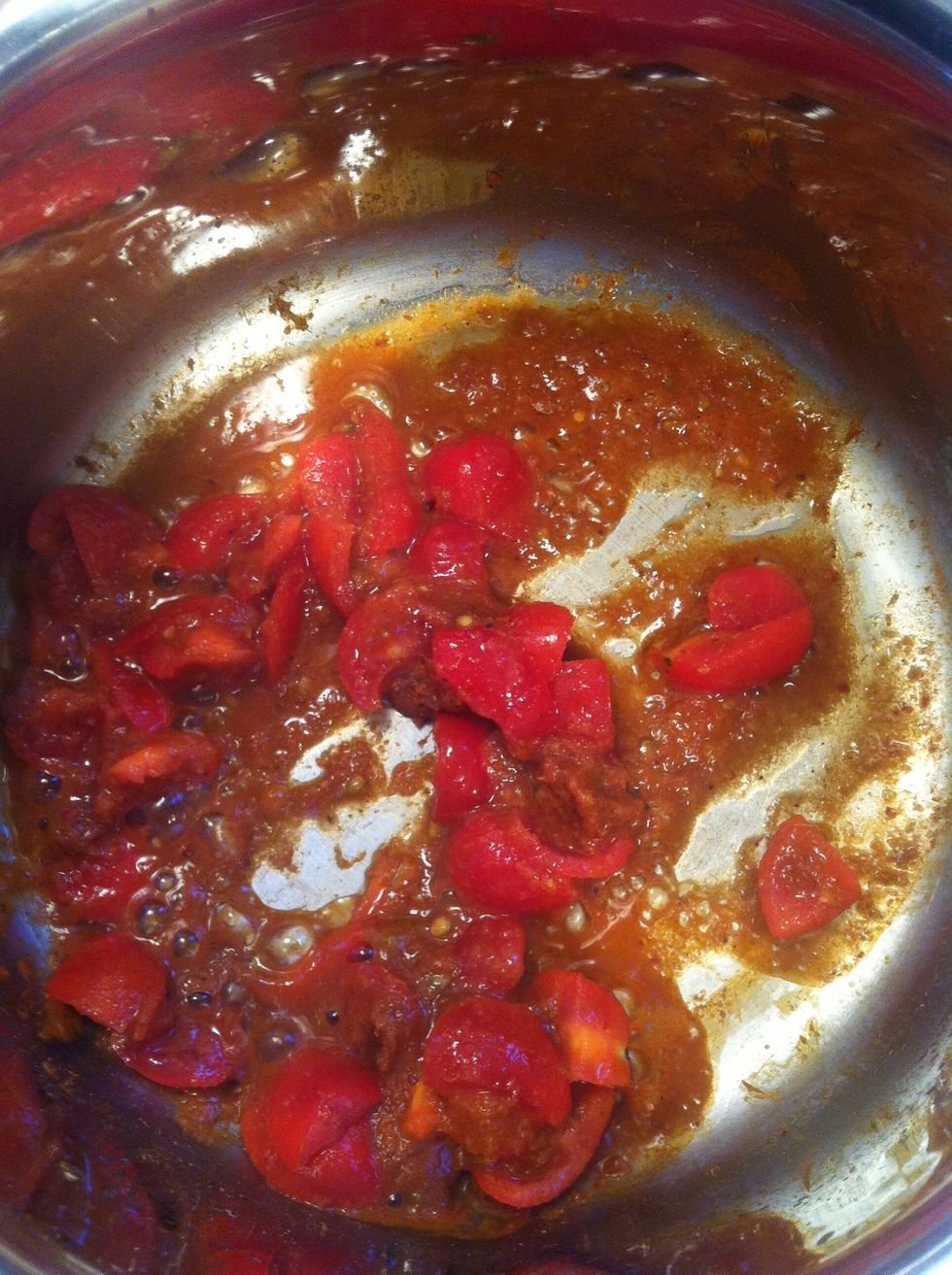 Heat oil in a pot on medium heat and then add red curry paste with tomatoes. Stir fried until fragrant and then add ground chicken/ground pork.