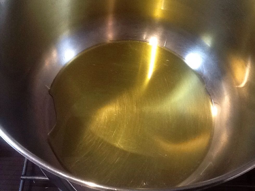 Heat oil in a saucepan over medium to high heat.