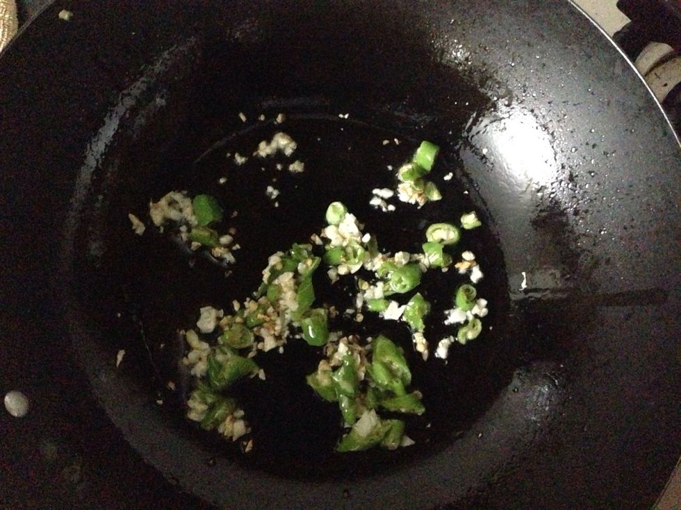 Heat oil in a wok add garlic and chilli. Fry for couple of minutes