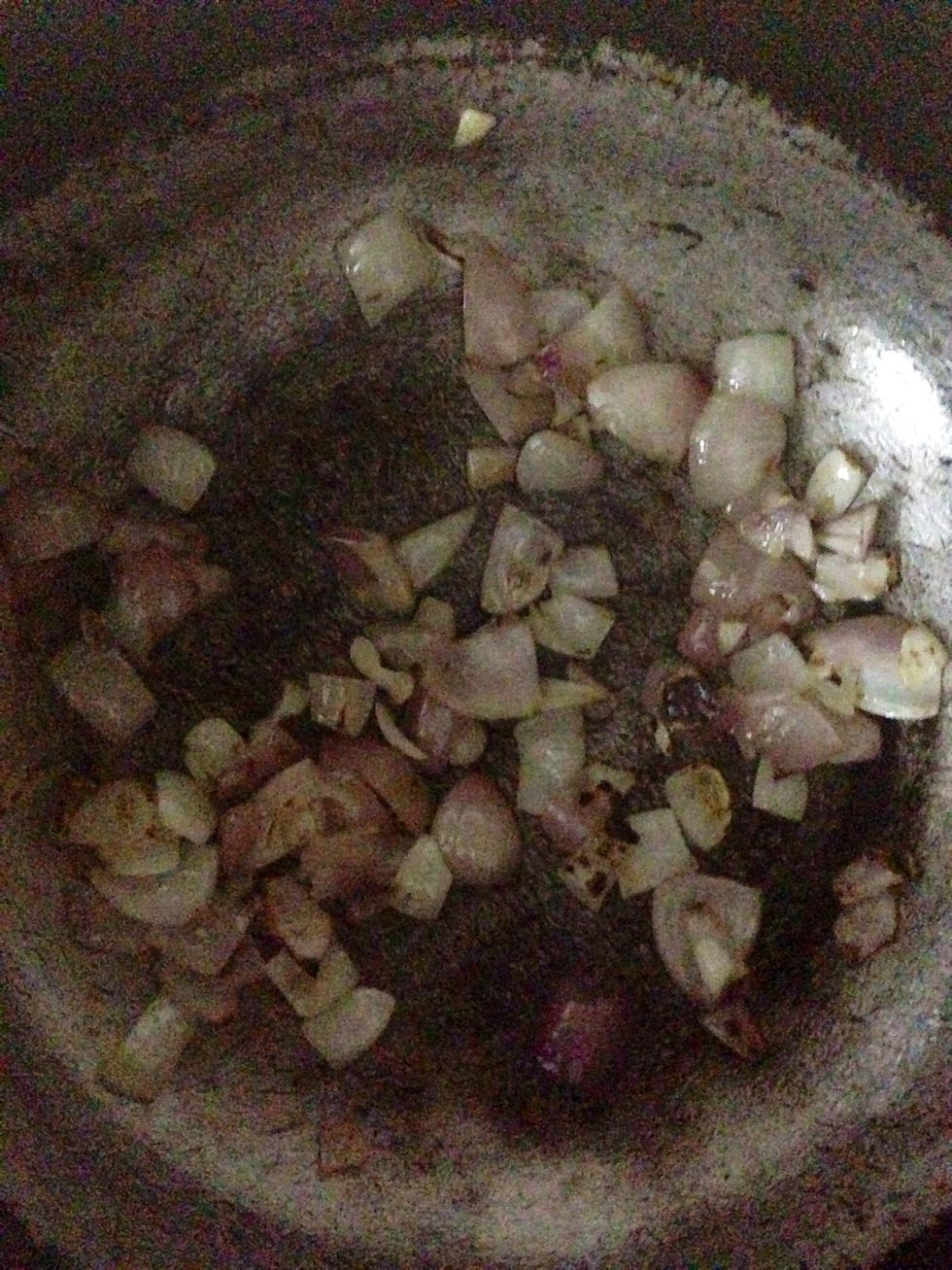 Heat oil in a wok and put the diced onions . Fry till they r lightly browned.