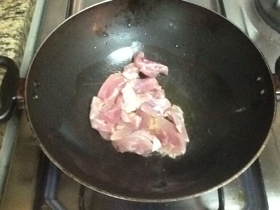 Heat oil in a wok & put chicken in it. Cook for 10 mins on high flame.
