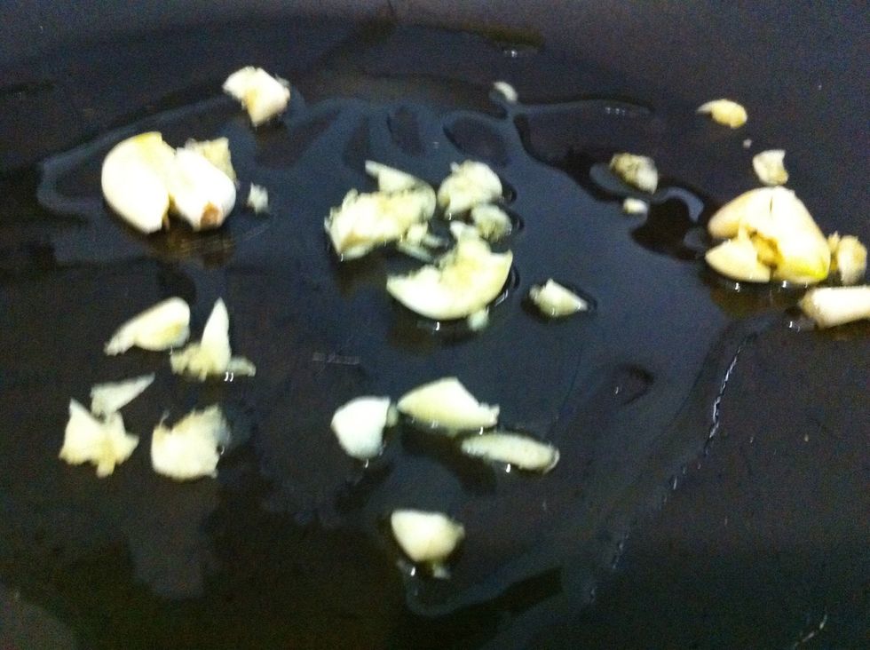Heat oil in pan then saut\u00e9 garlic