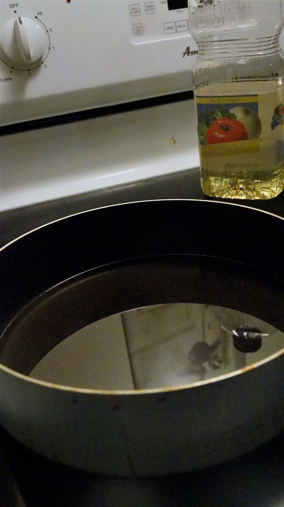 Heat oil in pan with high sides.Be careful you don't catch the oil on fire!