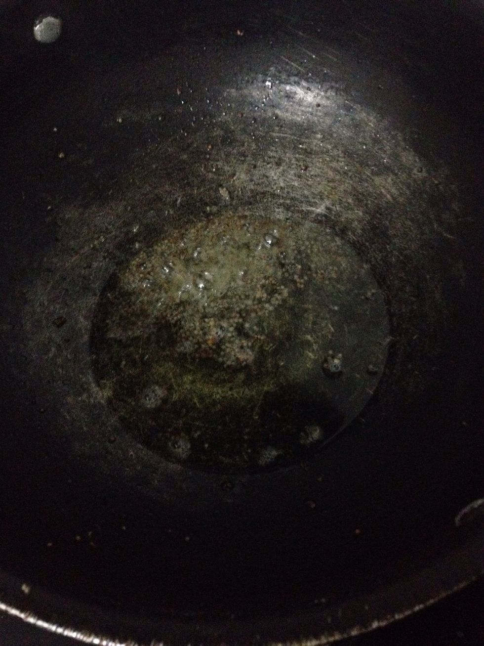 Heat oil in wok and add mustard seeds