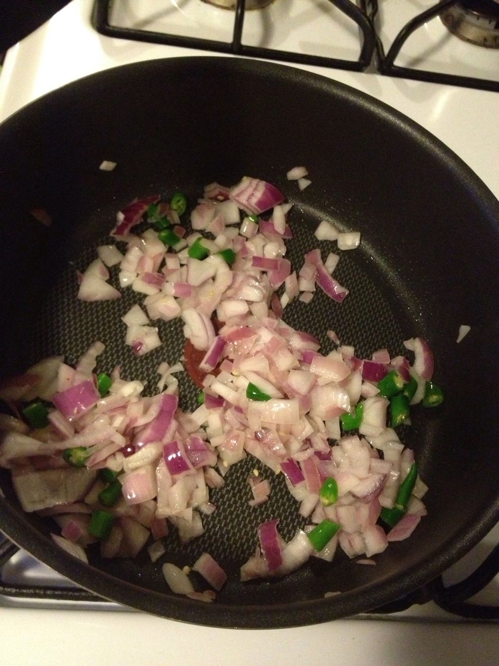 Heat oil on medium high and saut\u00e9 onion and green chilies until get aromatic. Then add 1 1/2 red curry paste stir well for 2 minutes.