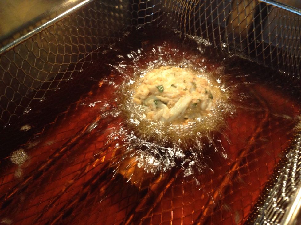 Heat oil to 375 degrees in your deep dryer, and lower the crab cakes into the oil with the basket. Dropping them in could cause them to break.