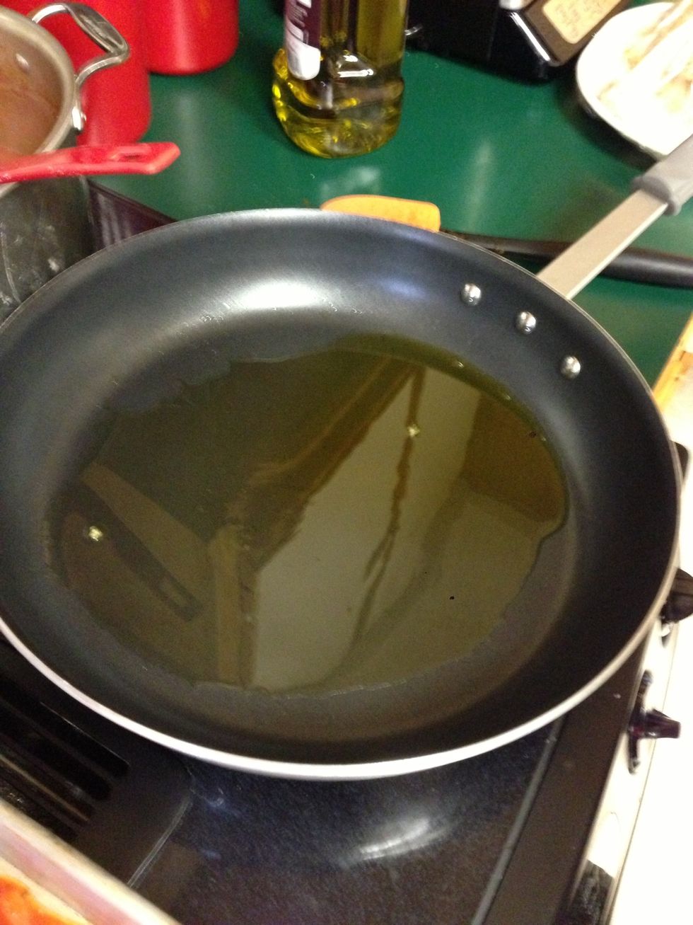 Heat olive oil in a large pan
