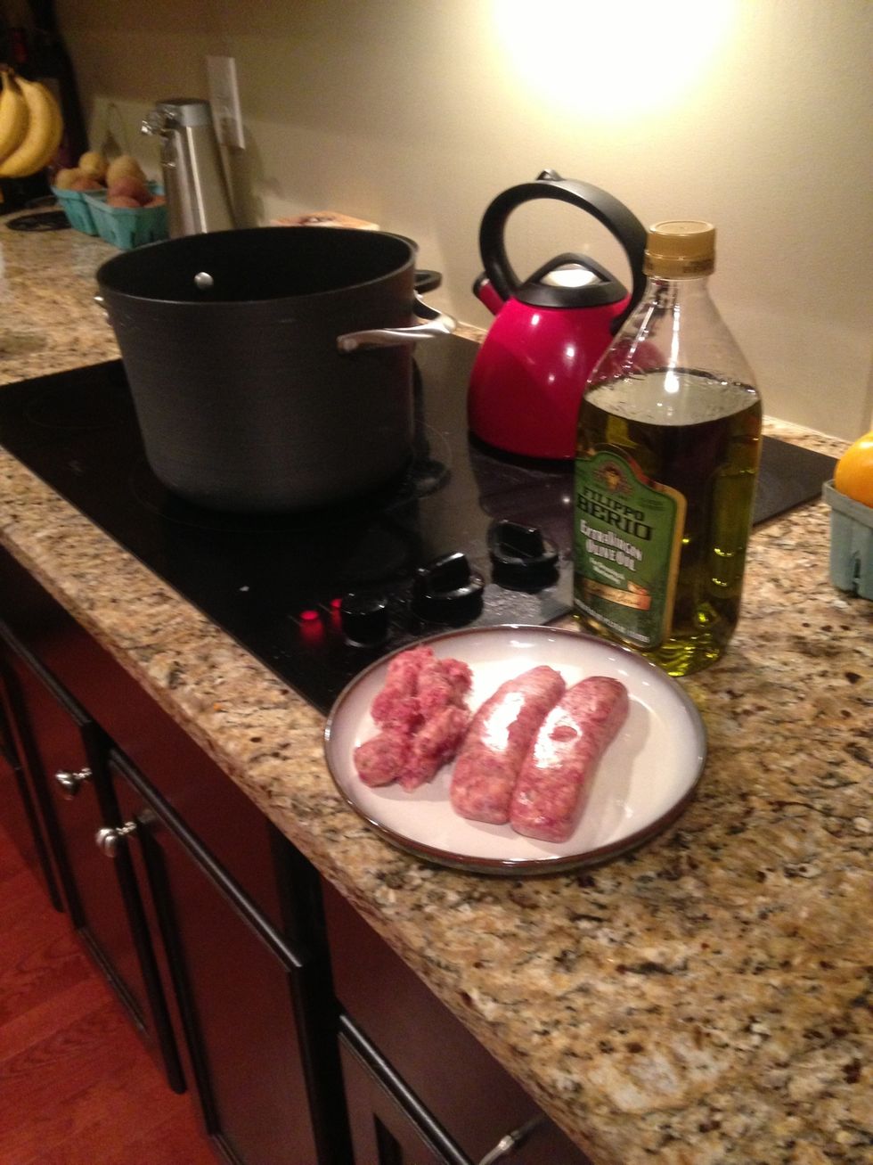 Heat olive oil in stock pot and add 3 Italian sausages, removed from casing and crumbled until browned (~5 min.)