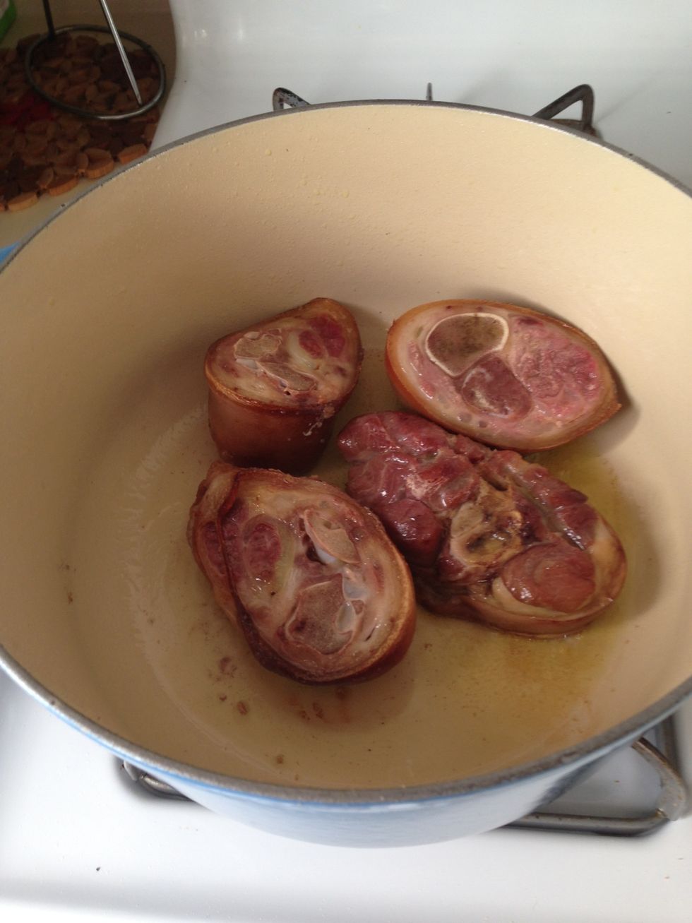 Heat olive oil on medium high in a Dutch oven or large soup pot. Add the ham hock and sear on all sides, for 4ish minutes. Note: if you want to make it vegan, skip this step.